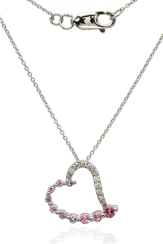 Diamond, sapphire and tourmaline necklace. Heart shaped pendant necklace set in white gold.
